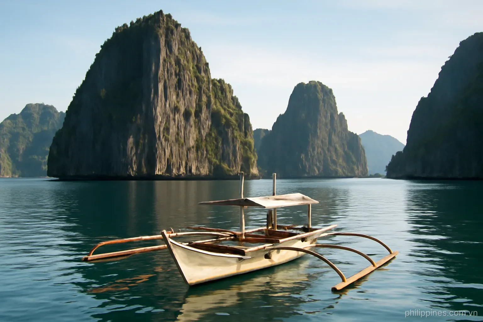 Limestone karst cliffs rising straight out of calm sea with a wooden outrigger boat in the foreground, no readable text